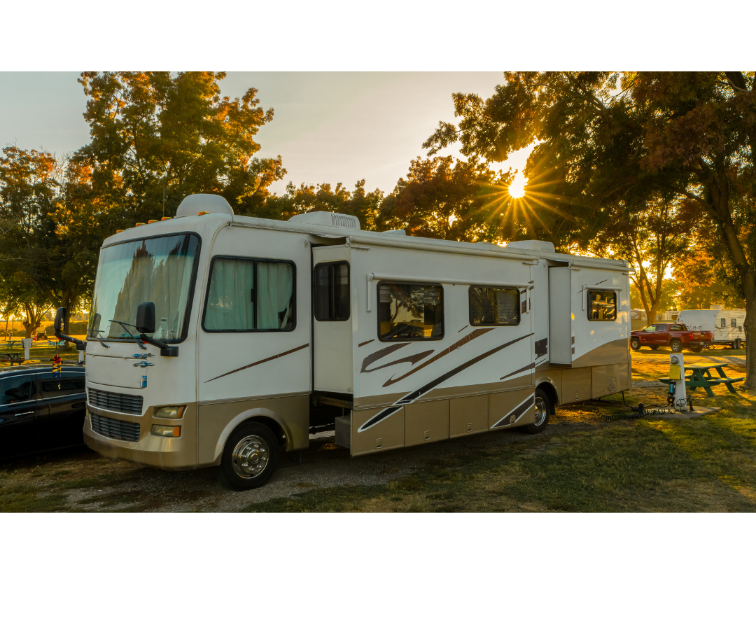 Pop-up camper parked by a lake